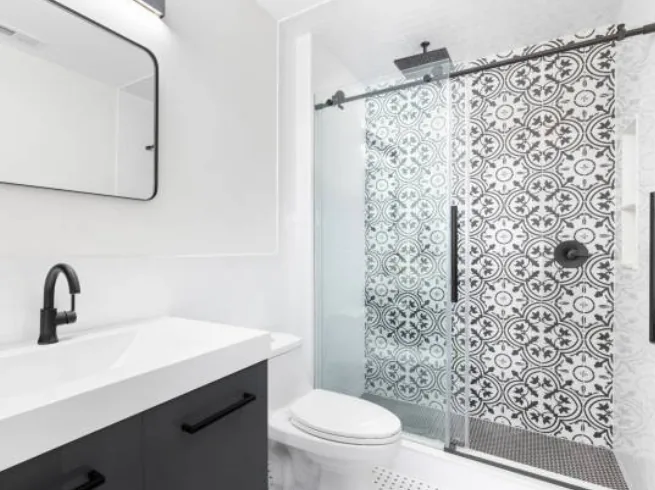 Sliding shower door installation in a compact bathroom