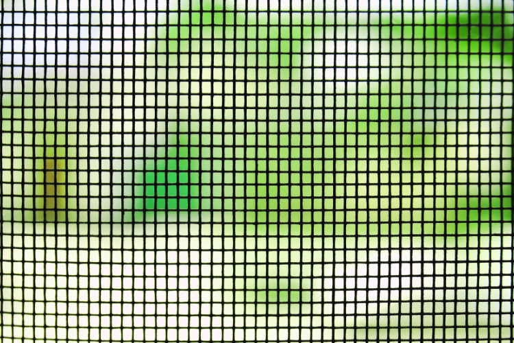 Close-up of screen door mesh — check for tears or damage when measuring for replacement