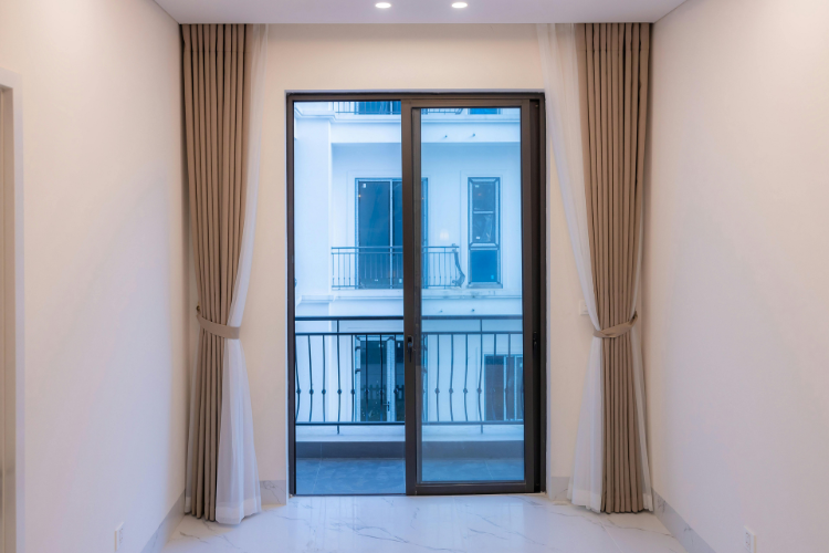 Sliding glass door with curtains — a properly aligned door should glide smoothly on its track