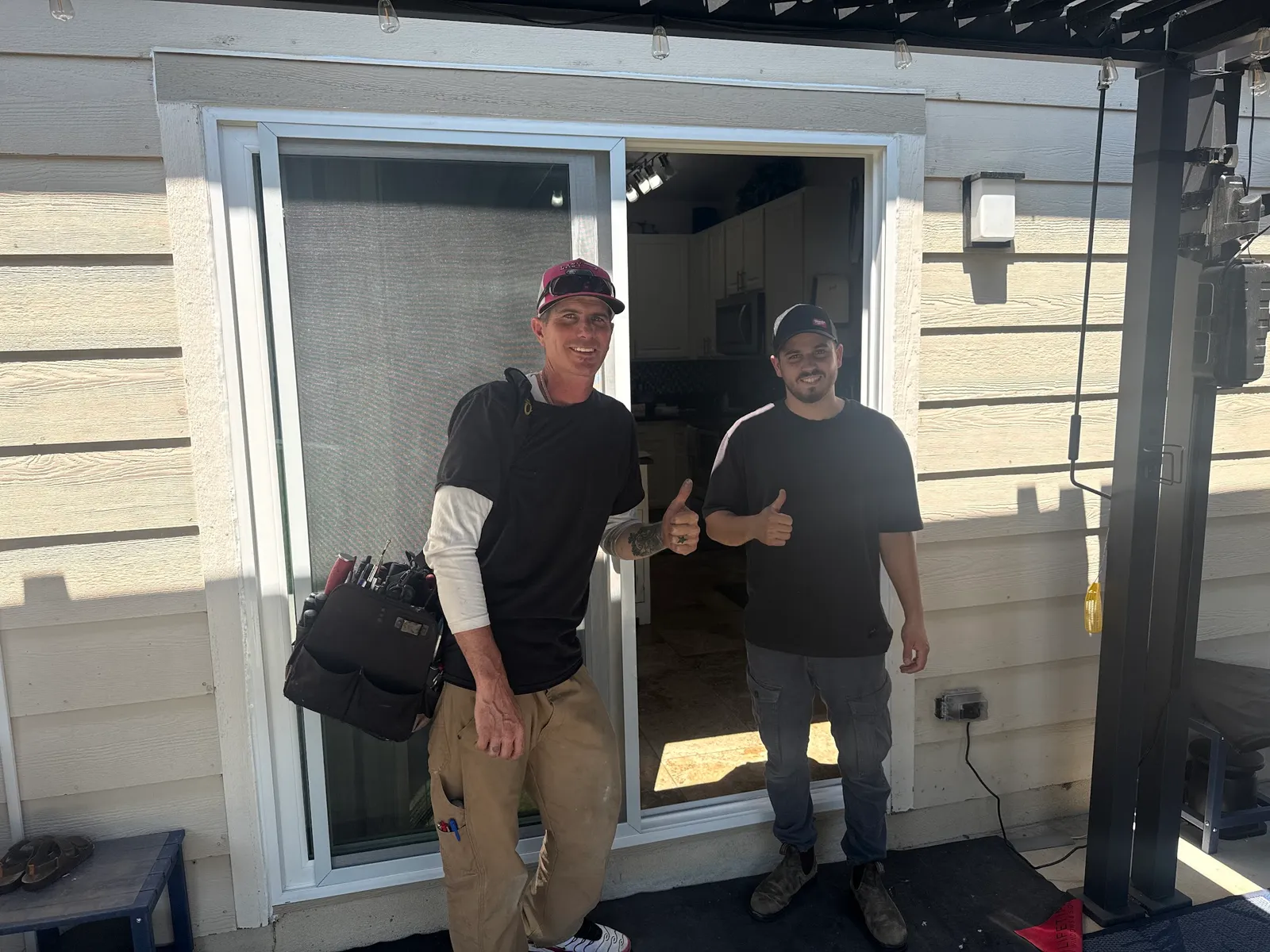 JDM team after a residential sliding glass door installation at a Colorado home