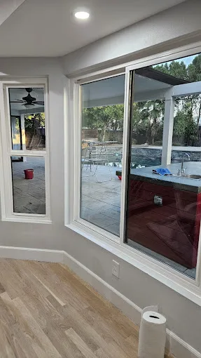 New impact window installed by JDM overlooking a Florida pool