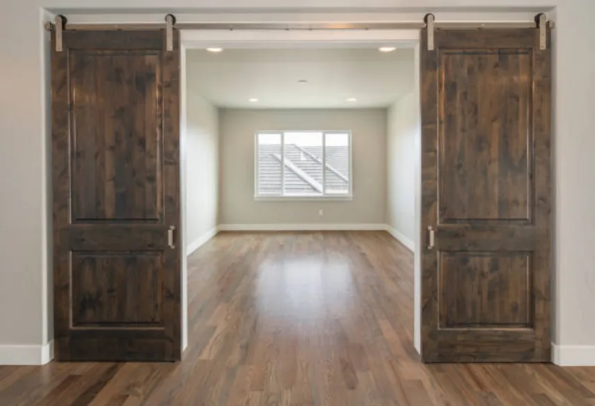 Interior barn doors on an exposed top track