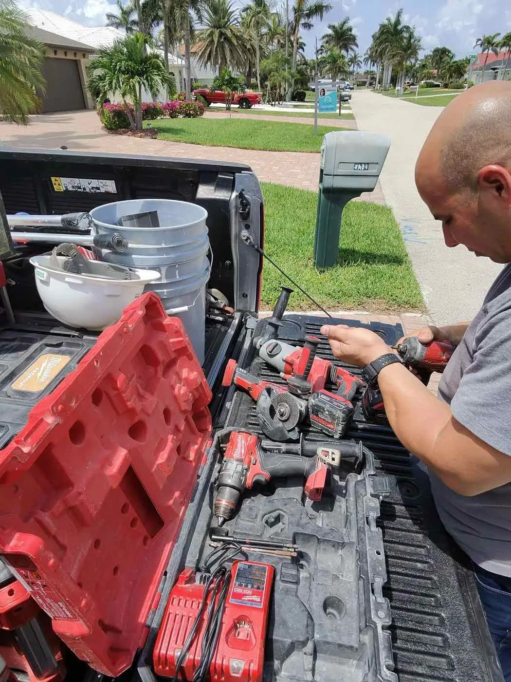 JDM technician loading tools for a Queens County service call